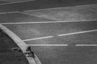 High angle view of people walking on road