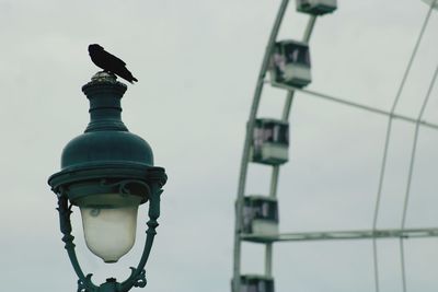 Low angle view of street light against sky