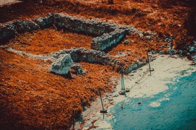 High angle view of rusty metal chain on land