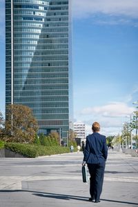 Full length of a man walking in city