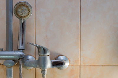 Close-up of faucet in bathroom