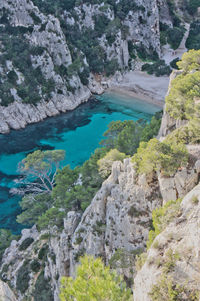 High angle view of rocks by sea