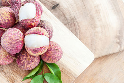 Directly above shot of fresh lychees on cutting board