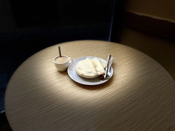 Close-up of wedding rings on table