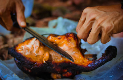 Close-up of man preparing food