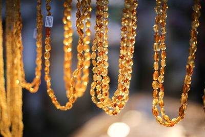 Close-up of chain hanging against blurred background