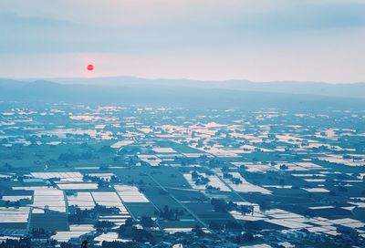 Aerial view of city against sky