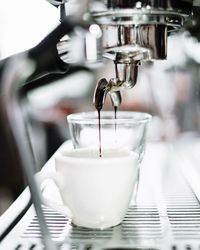 Close-up of coffee emitting in cup