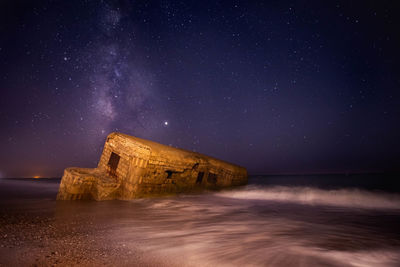 Scenic view of sea against sky at night