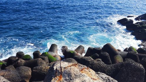 Scenic view of sea against rocks