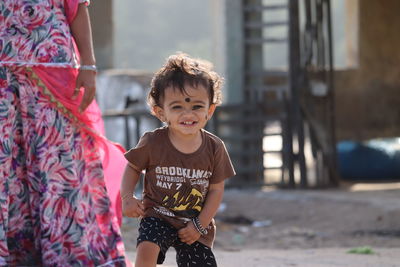 Happy brunet kid smiling at camera,portrait of children,chennai india