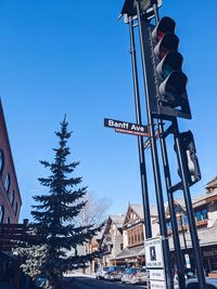 Low angle view of buildings against clear blue sky