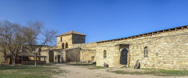 Old building against clear blue sky