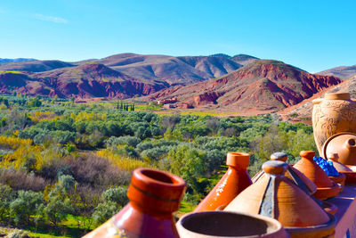 Scenic view of mountains against blue sky