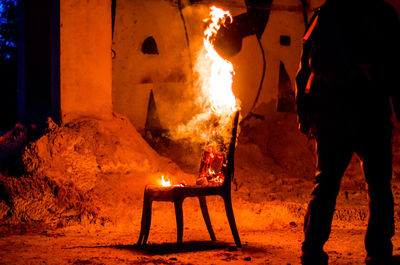 Wooden chair is on fire. incineration of furniture. conceptual photo, burnout