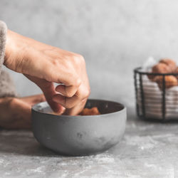 Close-up of person holding ice cream in bowl