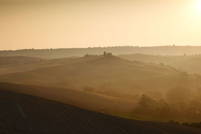 Scenic view of landscape against sky during sunset