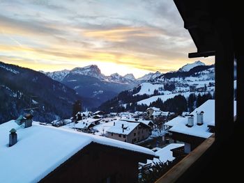 Scenic view of snowcapped mountains against sky during sunset