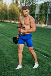 Low section of man exercising in park