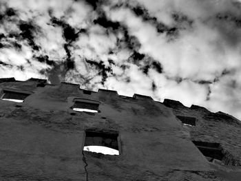 Low angle view of old building against sky