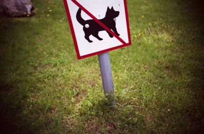 Road sign against sky