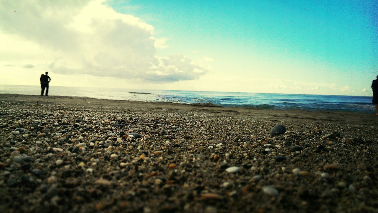 sea, beach, horizon over water, sky, shore, water, sand, tranquil scene, tranquility, scenics, leisure activity, lifestyles, standing, beauty in nature, nature, surface level, vacations, men