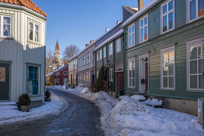 Houses against clear sky during winter