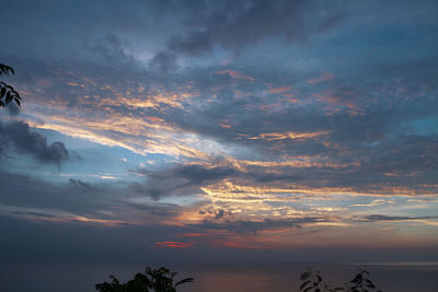 Low angle view of dramatic sky during sunset