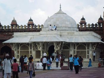 Group of people in front of historic building