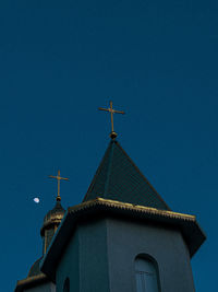 Low angle view of church against blue sky