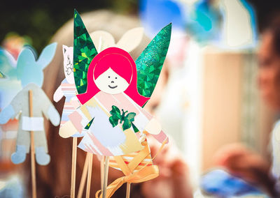 Close-up of person holding toy