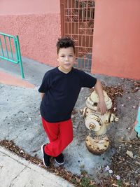 Portrait of boy standing outdoors