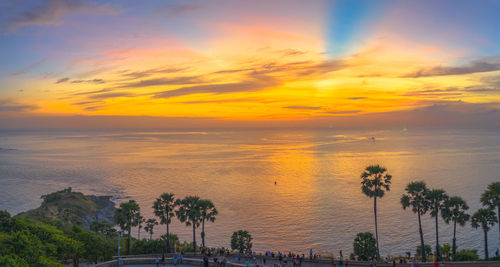 Scenic view of sea against orange sky