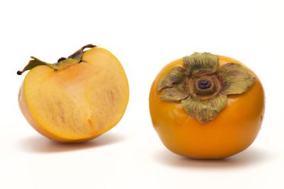 Close-up of oranges against white background