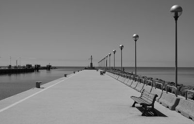 Scenic view of pier by sea against clear sky