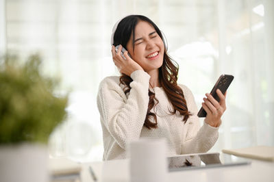 Young woman using mobile phone