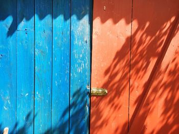 Sunlight falling on closed wooden door