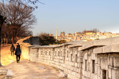 Rear view of man walking in city