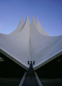 Low angle view of tempodrom berlin against clear blue sky