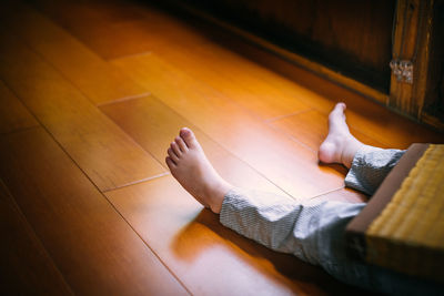 High angle view of child on floor at home