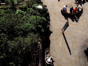 People walking by building