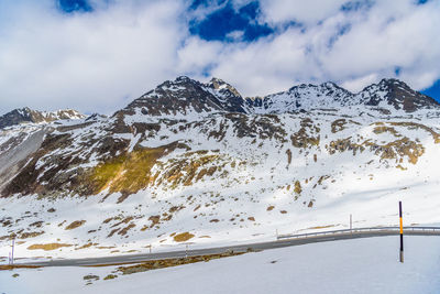 Scenic view of snow covered mountains against sky