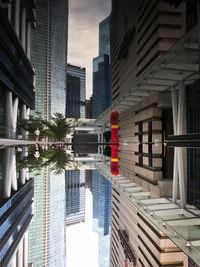 People in city against sky