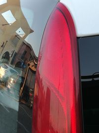 Low angle view of red car against sky