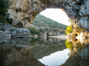 Scenic view of rock formation by mountain