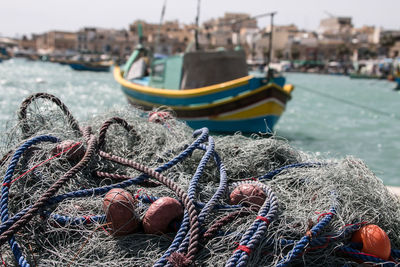 Fishing net on pier at harbor