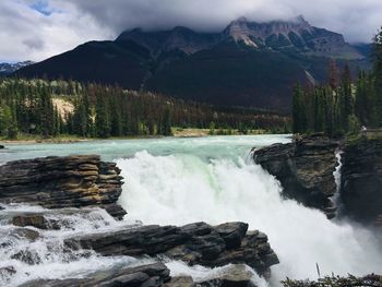 Scenic view of athabasca waterfall against sky in canada 