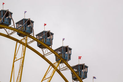 Low angle view of crane against clear sky