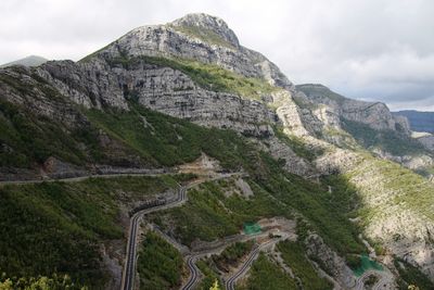 Scenic view of mountains and road against sky