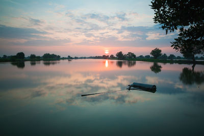 Scenic view of lake against sky during sunset